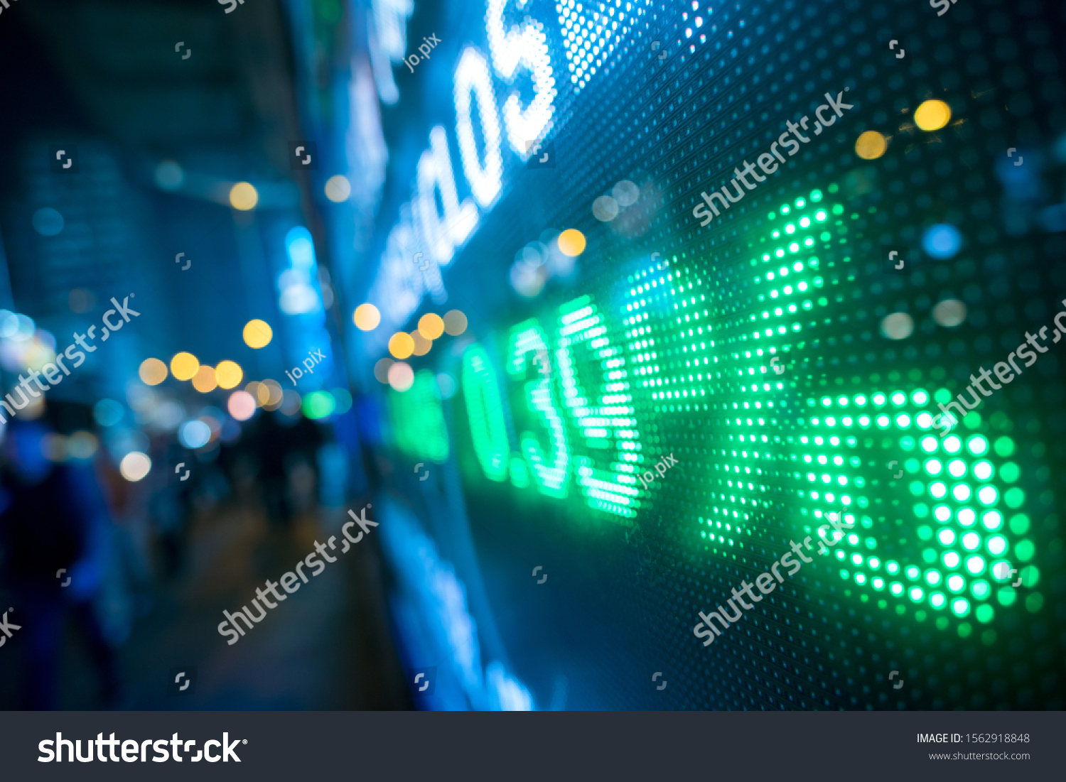 Display stock market numbers with defocused street lights background #1562918848