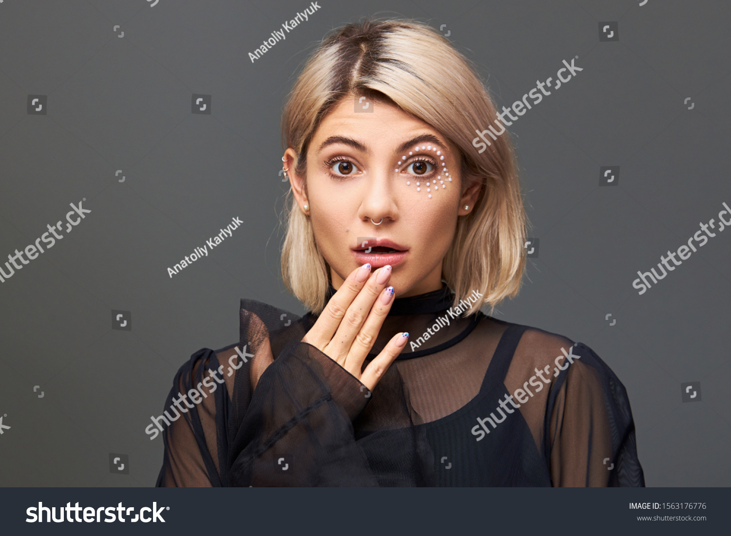 Human facial expressions, emotions and feelings. Gorgeous cute European female with blonde hair expressing genuine surprise and shock, opening mouth and popping eyes out, being in full disbelief #1563176776