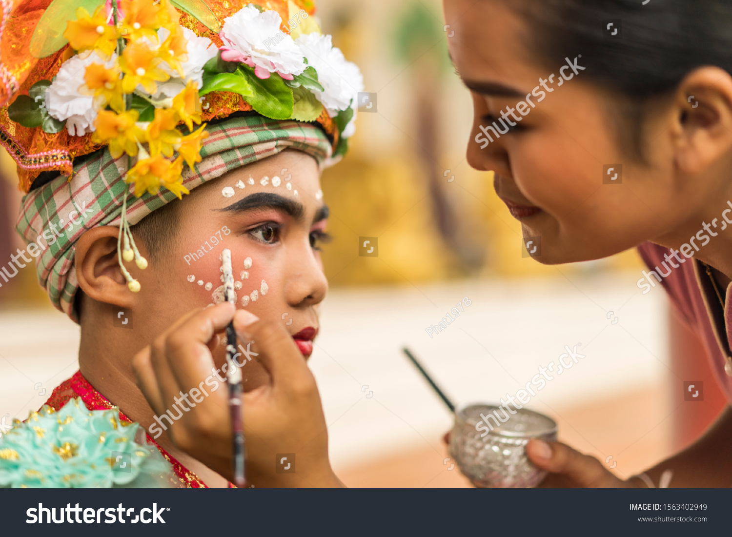 concept of Traditions Lanna novice monk tradition after having broken the head, must wear traditional style, draw eyebrows, red eyes, put on bracelets, necklace, Sangkhathan and pray for adult parade. #1563402949