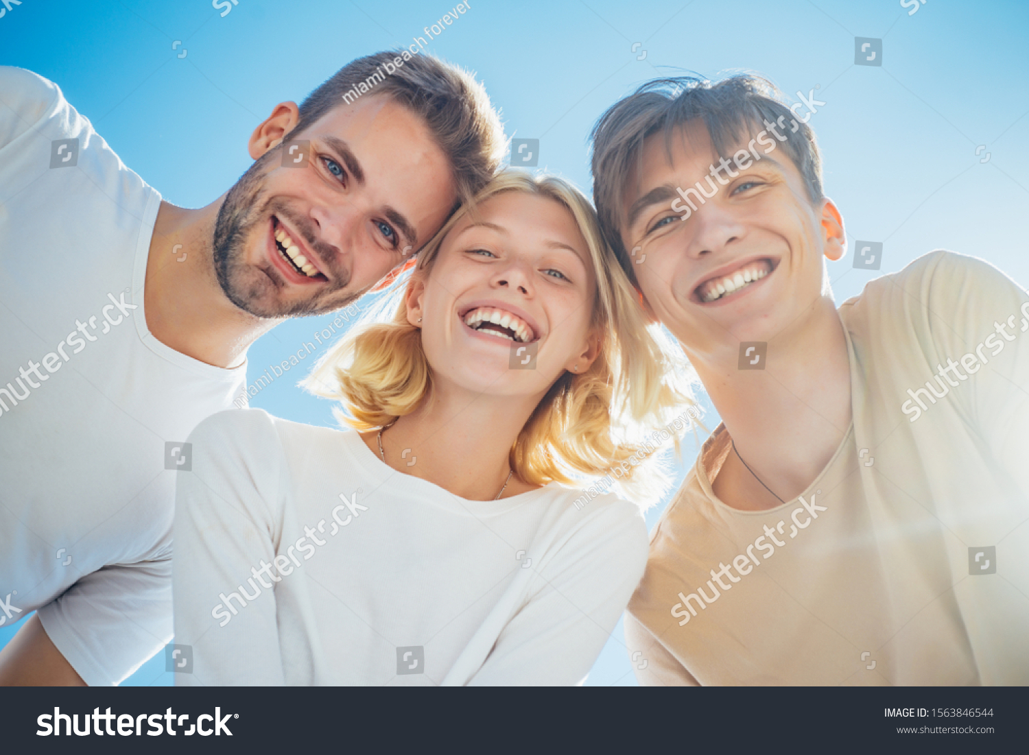Happy group young people. Cheerful smiling happy best friends walking outdoor together and having great time. Sweet memories about summer holidays. Leisure activity and friendship concept #1563846544