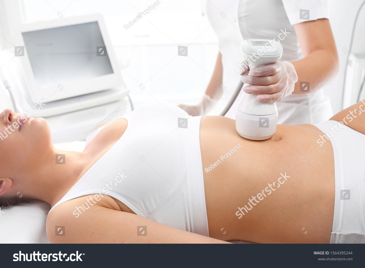 Tummy firming and shaping, slimming the figure. A slimming treatment for the abdomen using a specialized head #1564395244