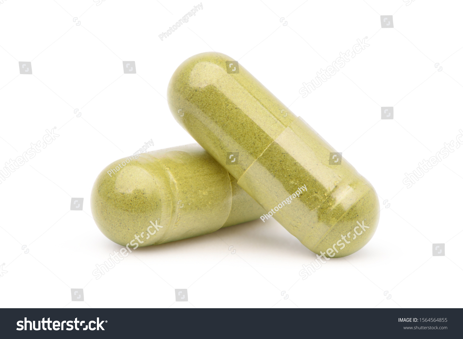 Close-up Two Herb powder capsules isolated on white background. Clipping path. #1564564855