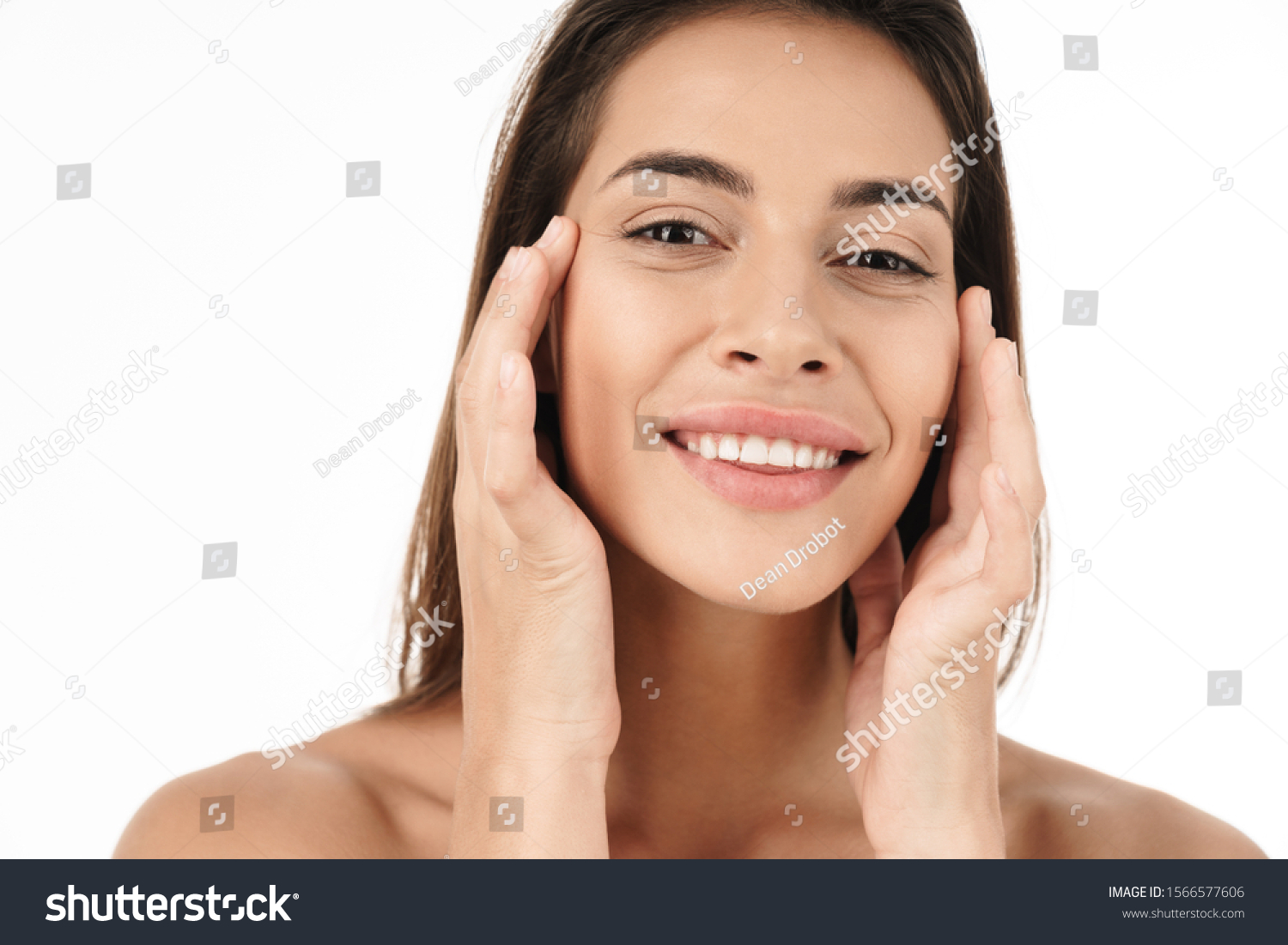 Portrait of charming young brunette half-naked woman smiling and touching her face isolated over white background #1566577606