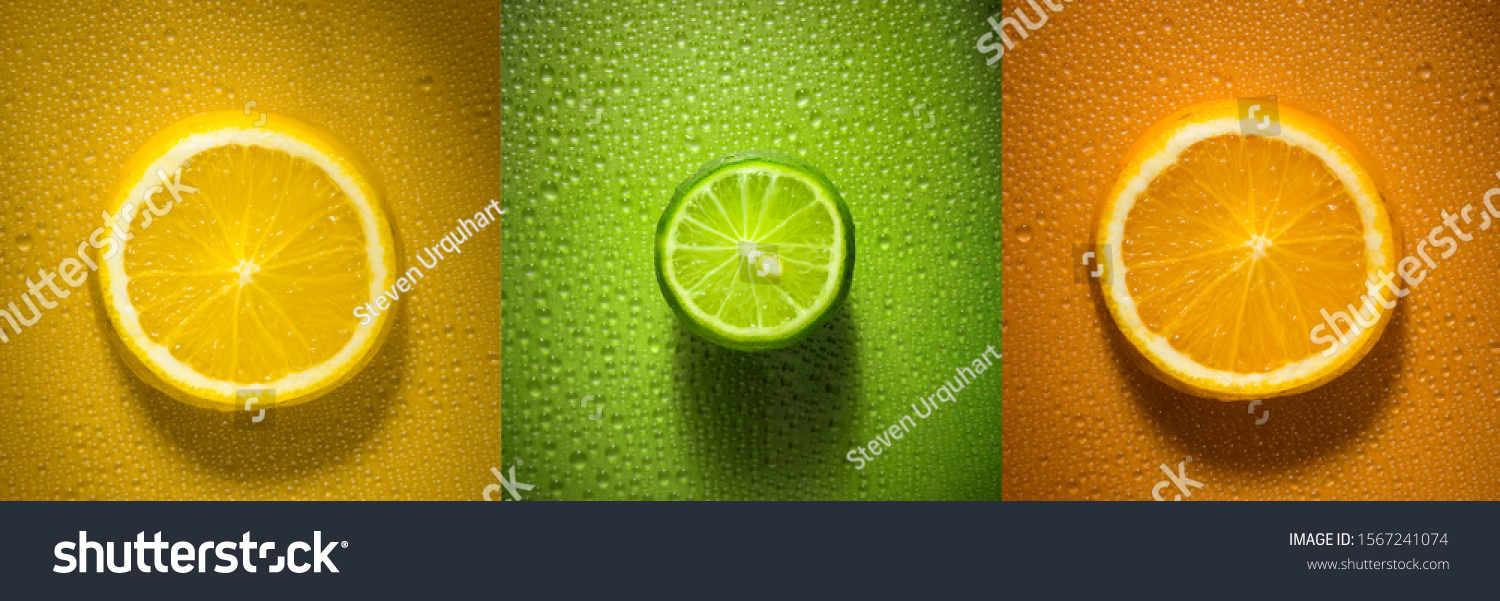 Sliced citrus fruit orange lemon and lime with water droplets creating texture - fresh and healthy food concept image #1567241074