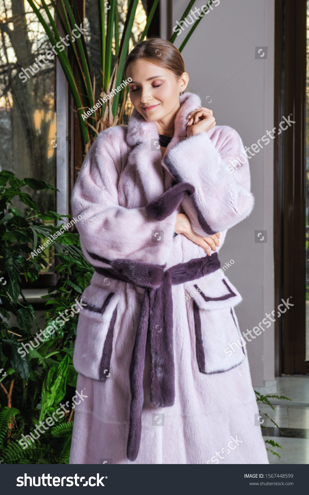 Beautiful fashion model posing in fur coat #1567448599