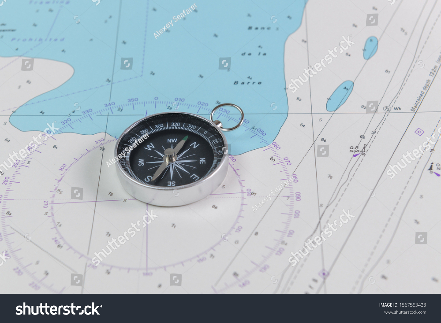 Magnetic compass on a nautical navigational map #1567553428