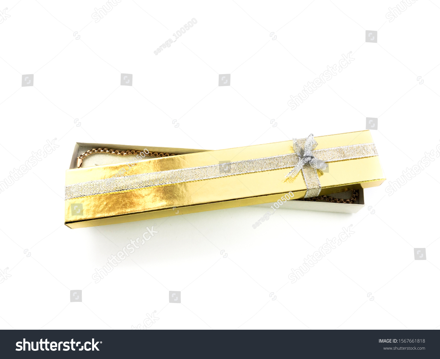 Golden gift box isolated on a white background. Yellow gift wrap for jewelry. Packaging for jewelry. Packaging with a bow. Packaging for a necklace. #1567661818