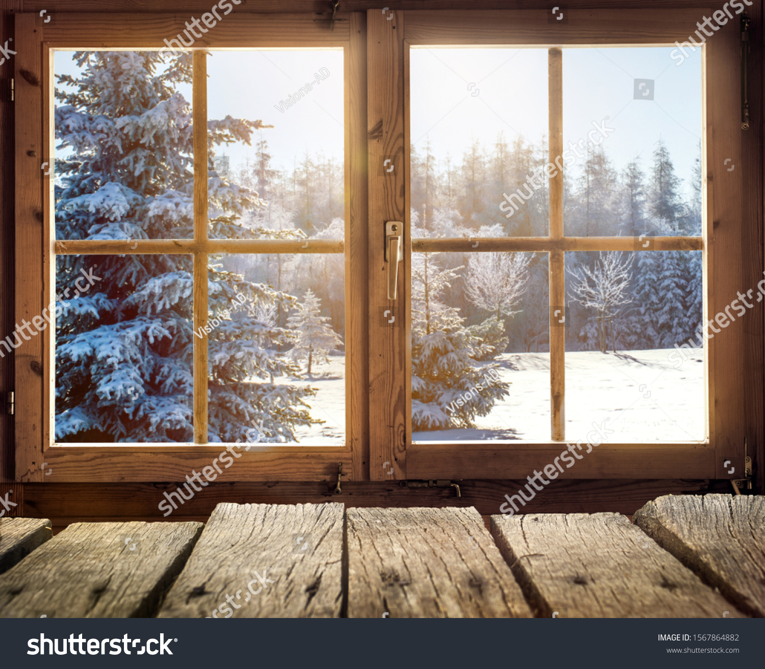 View through the window of a cottage into a snow-covered winter forest #1567864882