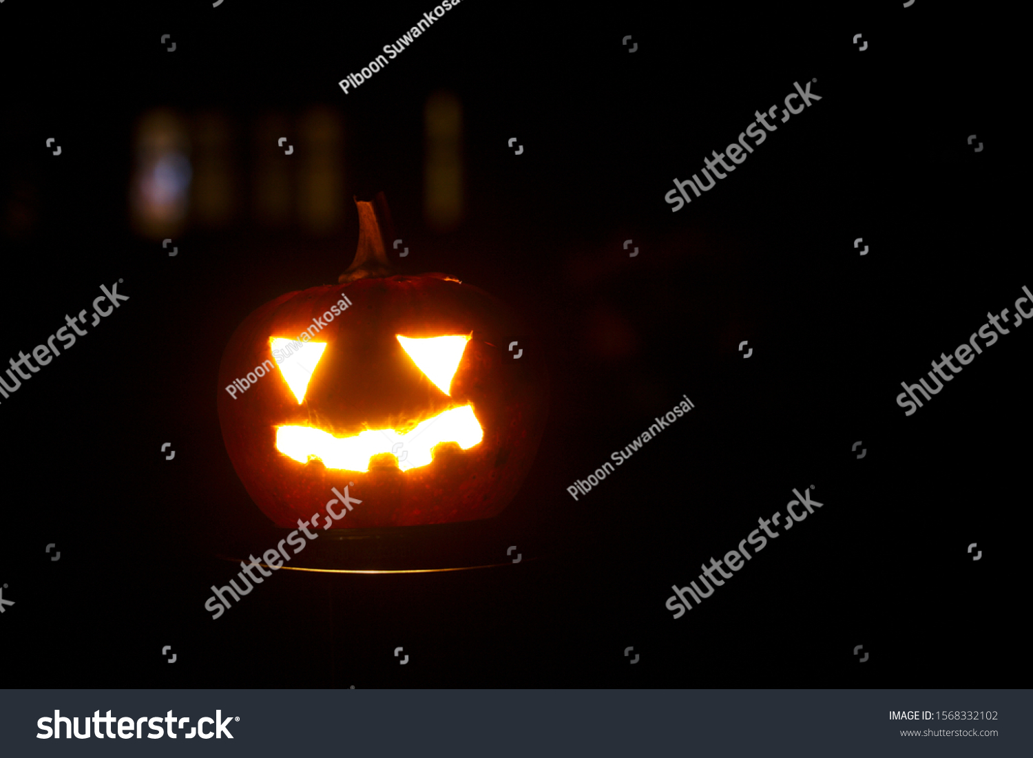 halloween pumpkin on drakness background. #1568332102