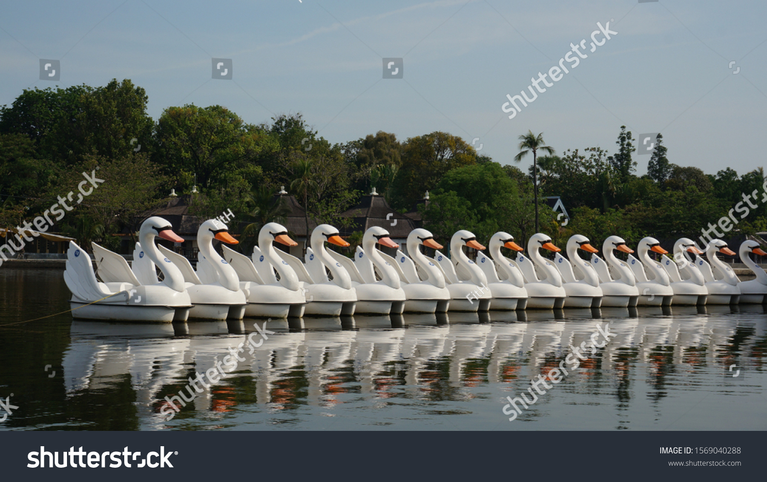 Paddleboats with shape of swans, at Ancol Beach Jakarta Indonesia  #1569040288