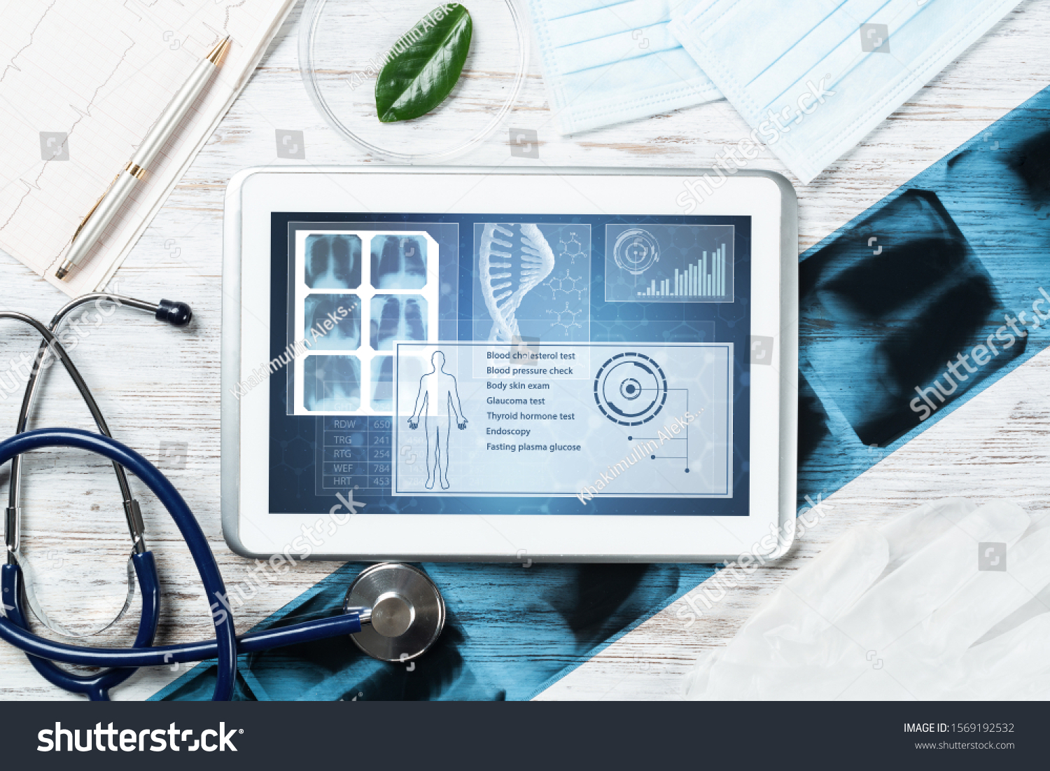 Human genetic research in medical laboratory. Tablet computer with DNA helix structure on screen. Stethoscope, x-ray image and cardiogram on wooden desk. Medical diagnostics and patient genome testing #1569192532