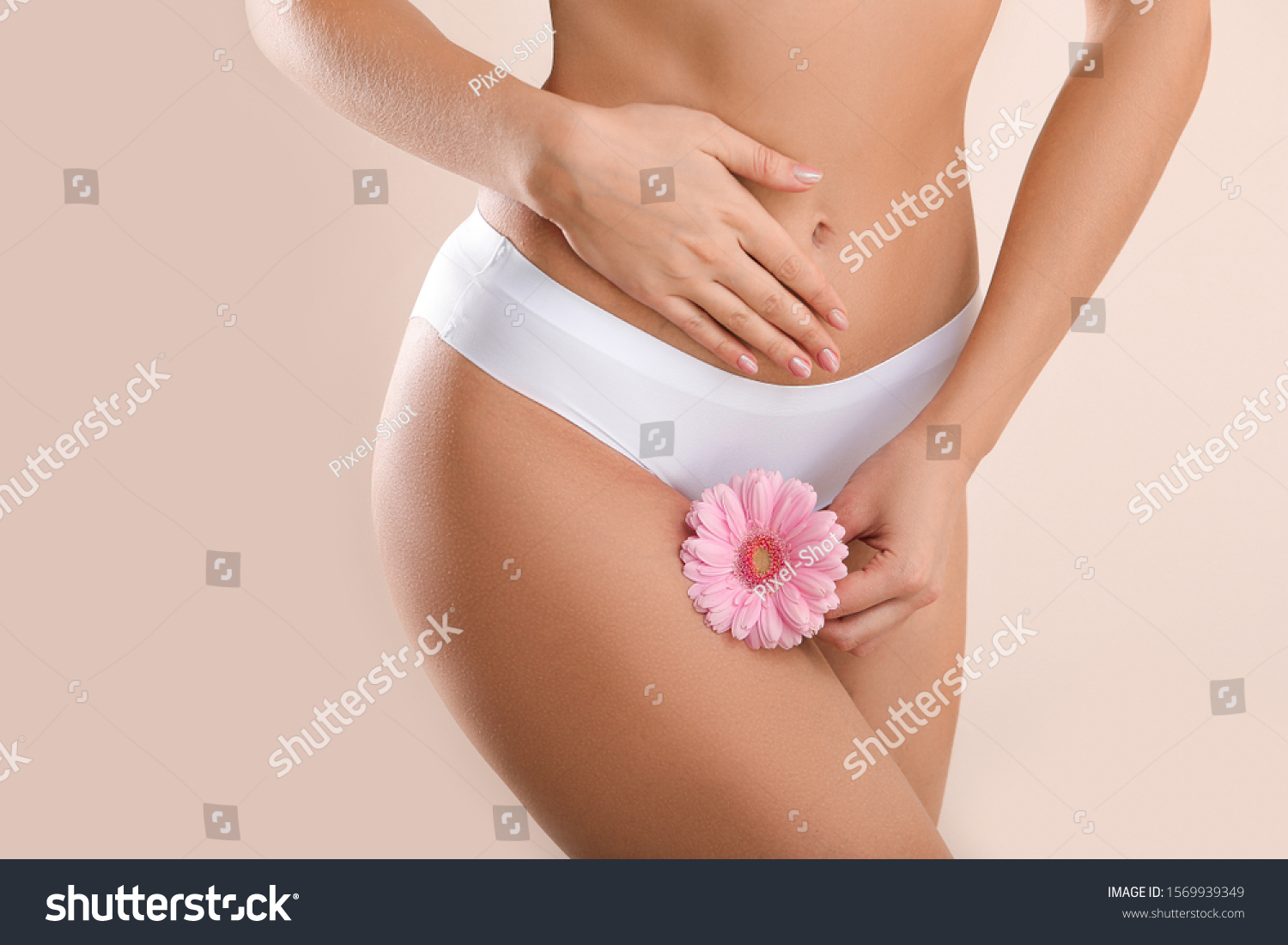 Young woman with flower on light background. Gynecology concept #1569939349