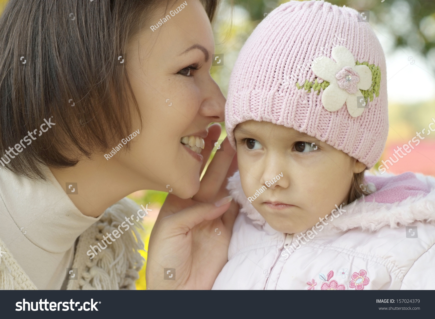 portrait of a beautiful mother and a little girl in the autumn #157024379