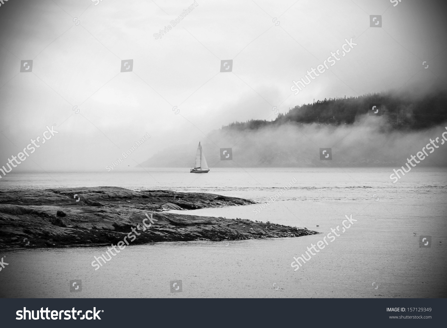Romantic landscape: sailboat in the fog in dramatic  black and white #157129349