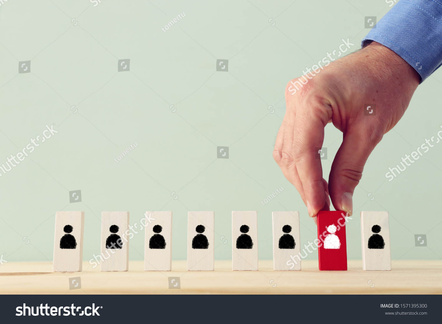 Business concept image of tangram puzzle blocks with people icons over wooden table, human resources and management concept #1571395300