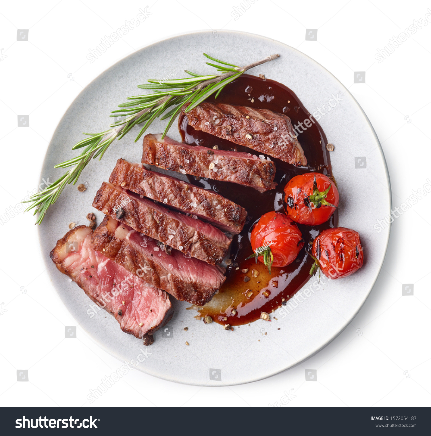 Grilled sliced Beef Steak with tomatoes and rosemary on a plate Isolated on white background top view #1572054187