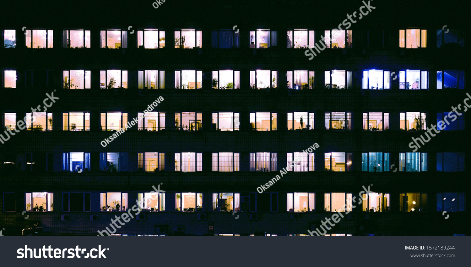 tetris of windows with light inside in the evening #1572189244