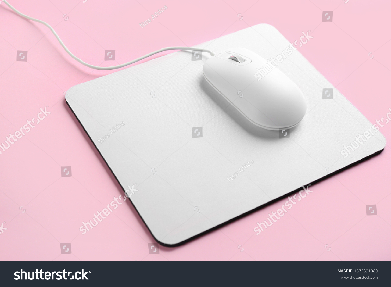 Modern wired optical mouse and pad on pink background #1573391080