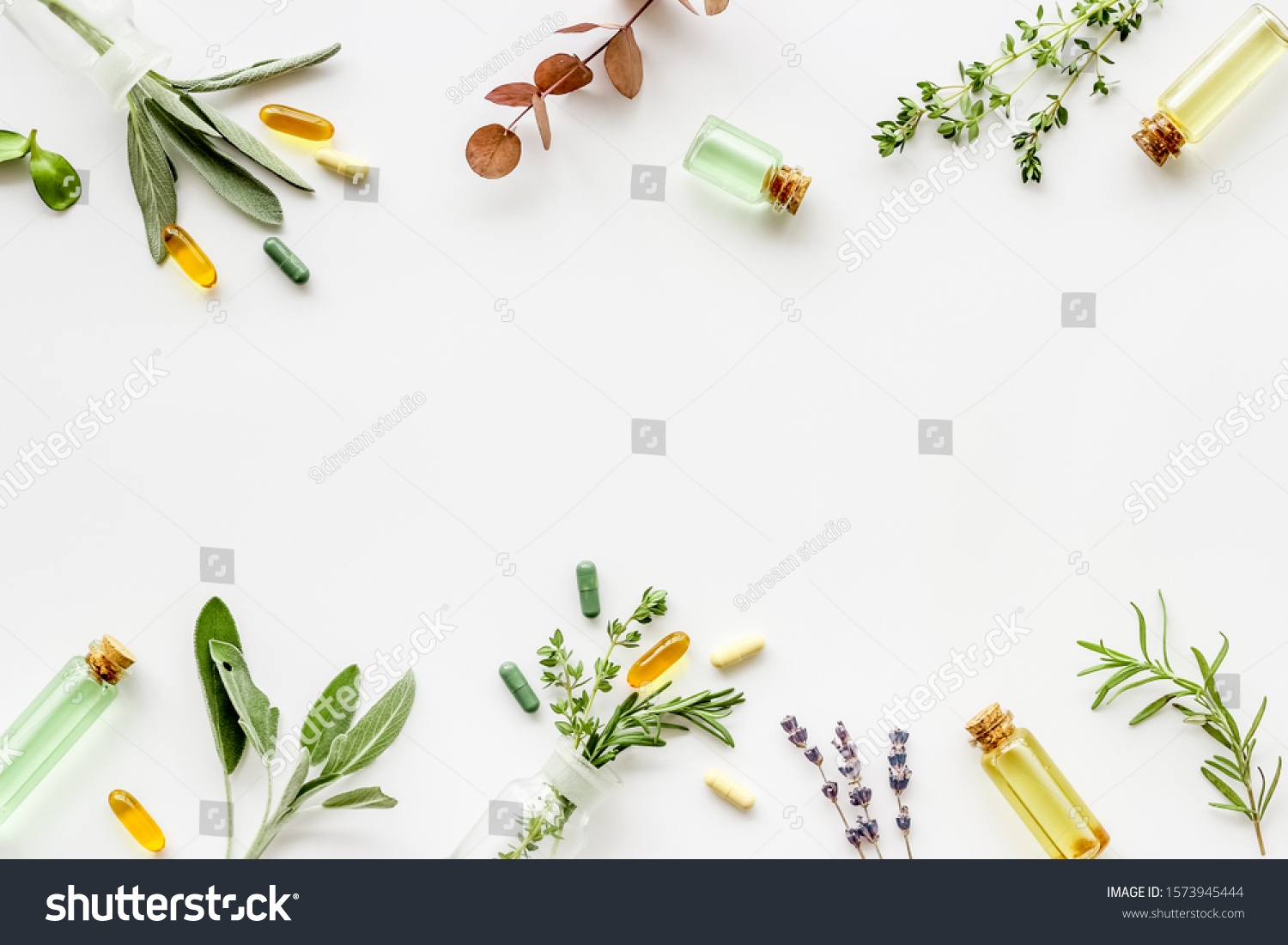 Apothecary of natural wellness and self-care. Herbs and medicine on white background top view frame copy space #1573945444