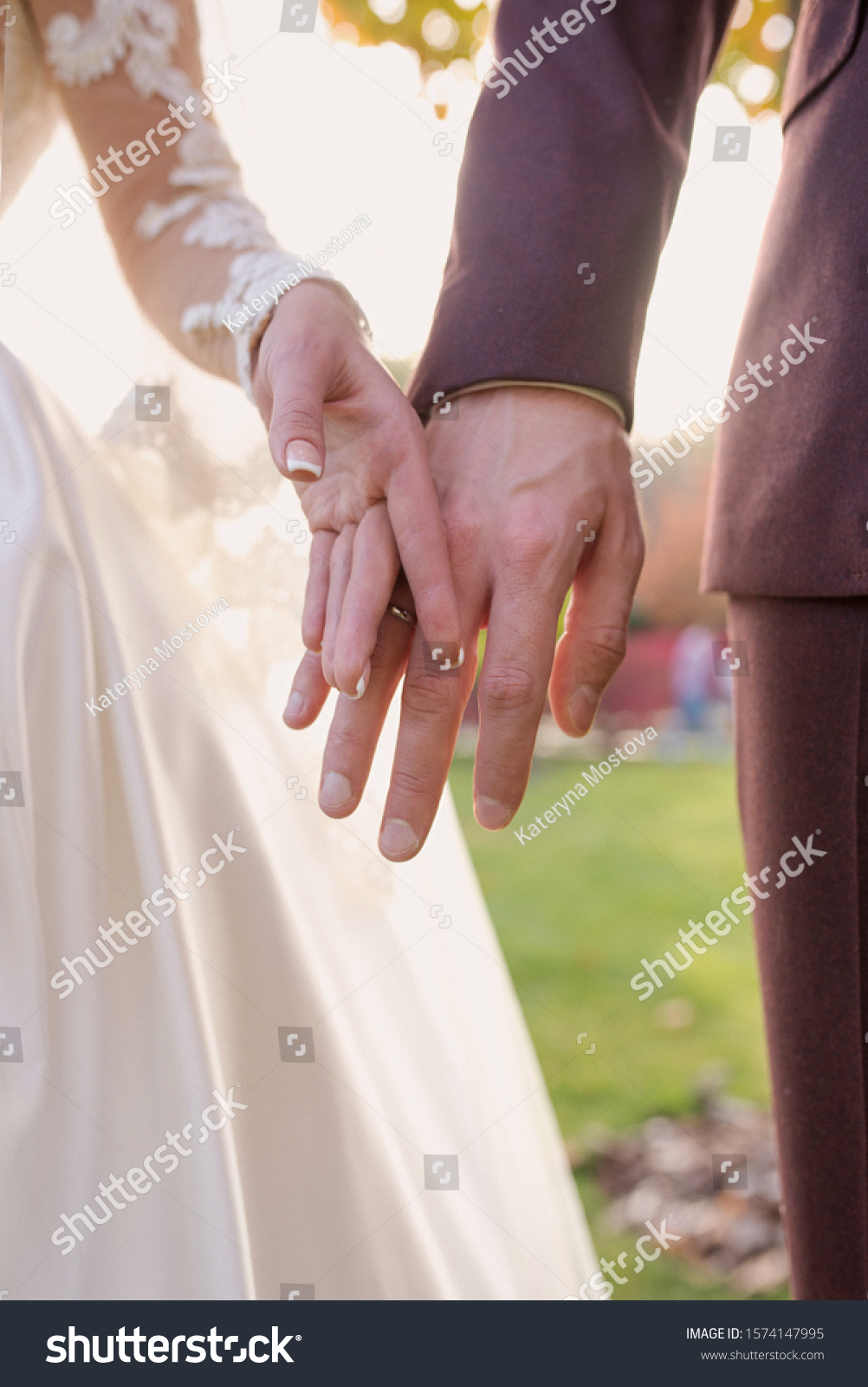 hands of wedding couple  in love. Relationship, love and tenderness concept #1574147995