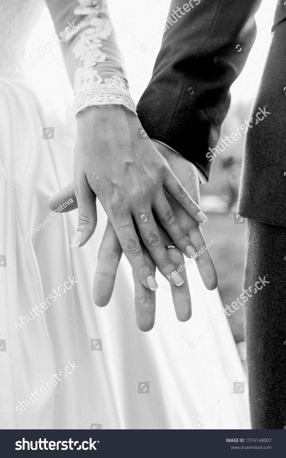 hands of wedding couple  in love. Relationship, love and tenderness concept #1574148007