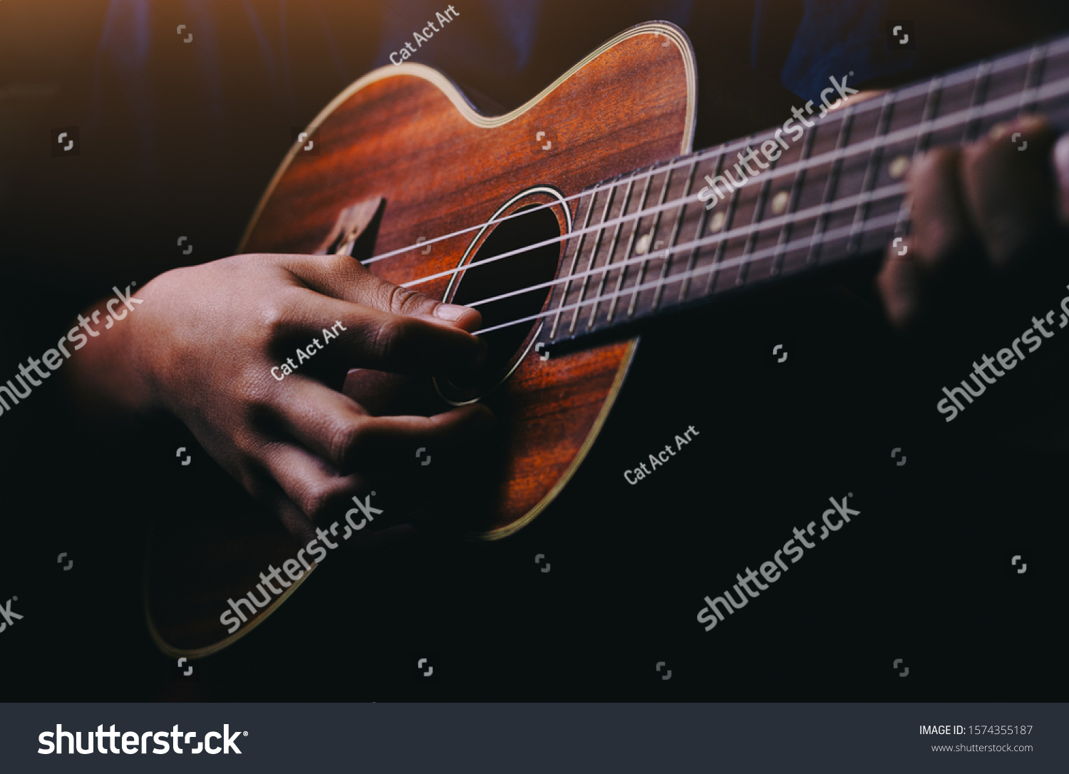 Hands playing acoustic guitar ukulele #1574355187