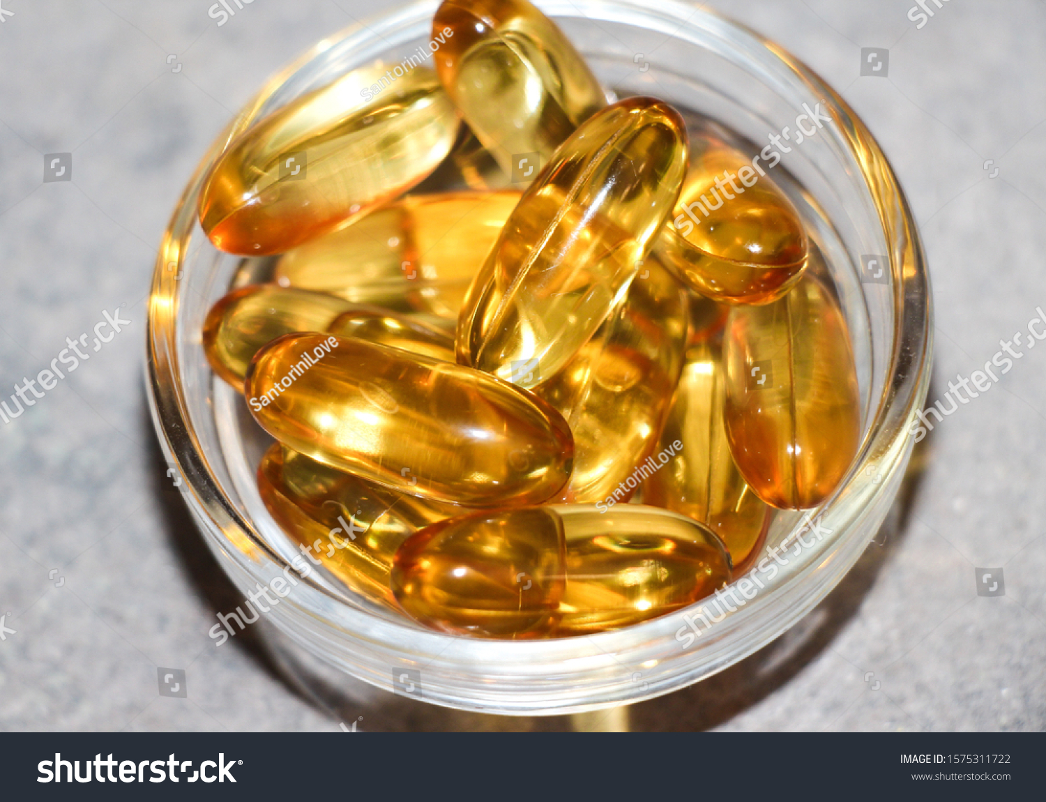 Realistic yellow gelatin capsule with omega 3. Omega-3 fish oil capsules #1575311722