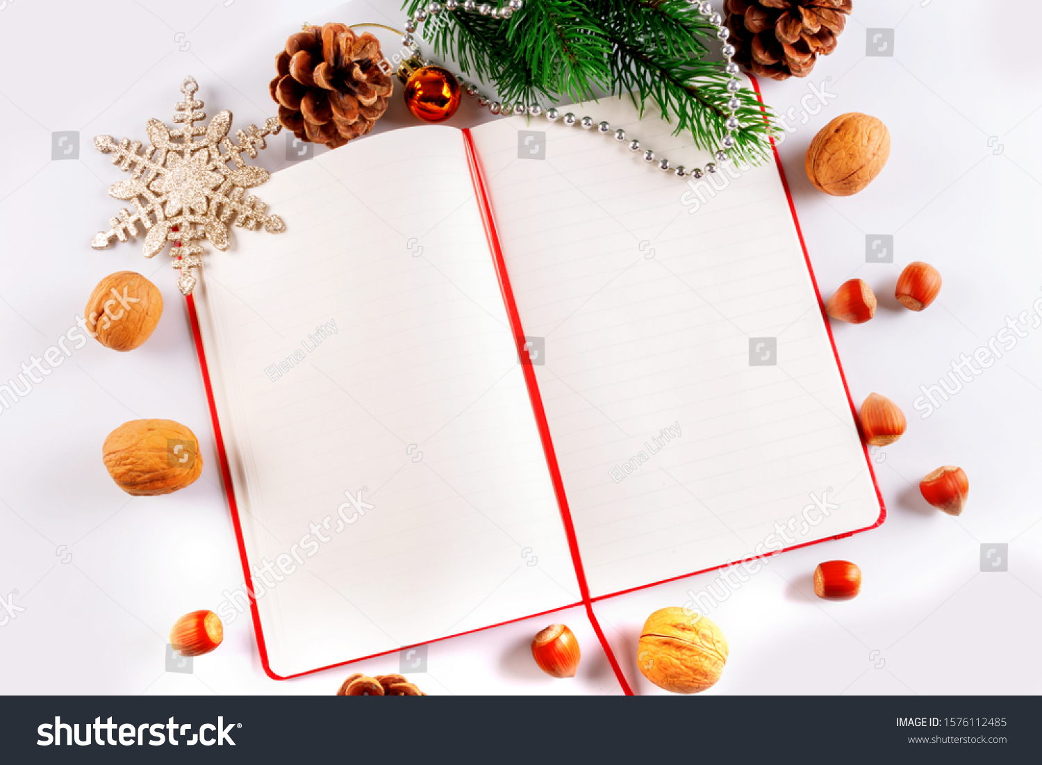 Christmas card with Christmas decorations and a diary with copy space for writing wishes #1576112485
