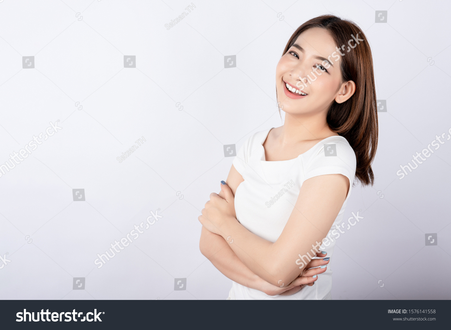 Beautiful young asian stand and pose with big smile happy beaming face in white background. #1576141558