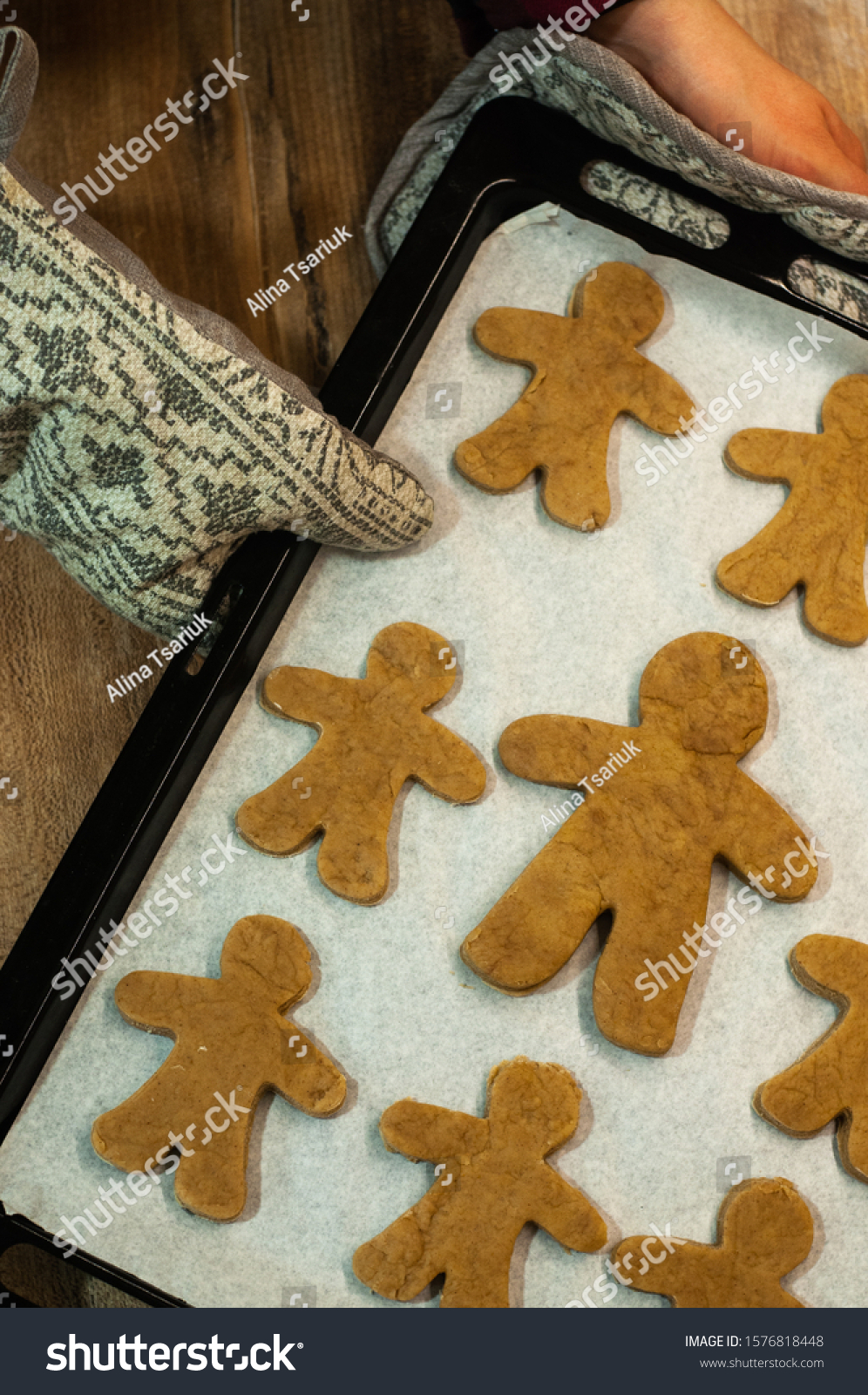 Fresh baked homemade Chritstmas gingerbread cookie on a baking tray. #1576818448