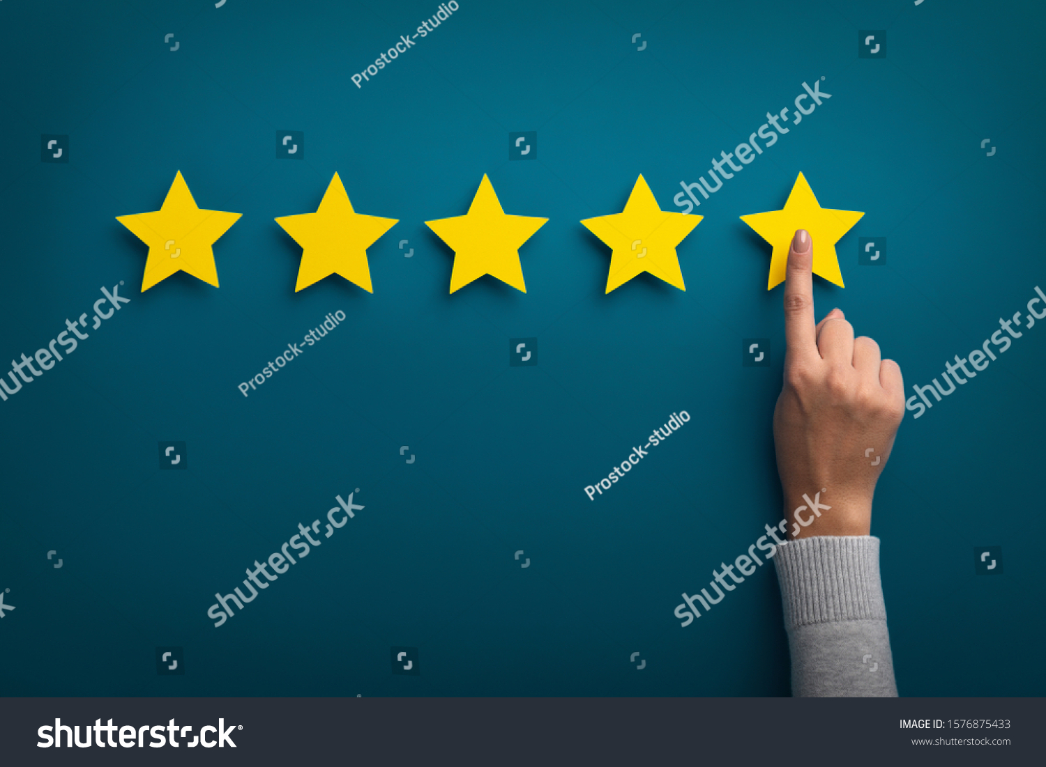 Customer Experience Concept. Woman hand showing on five star excellent rating on background, copy space #1576875433