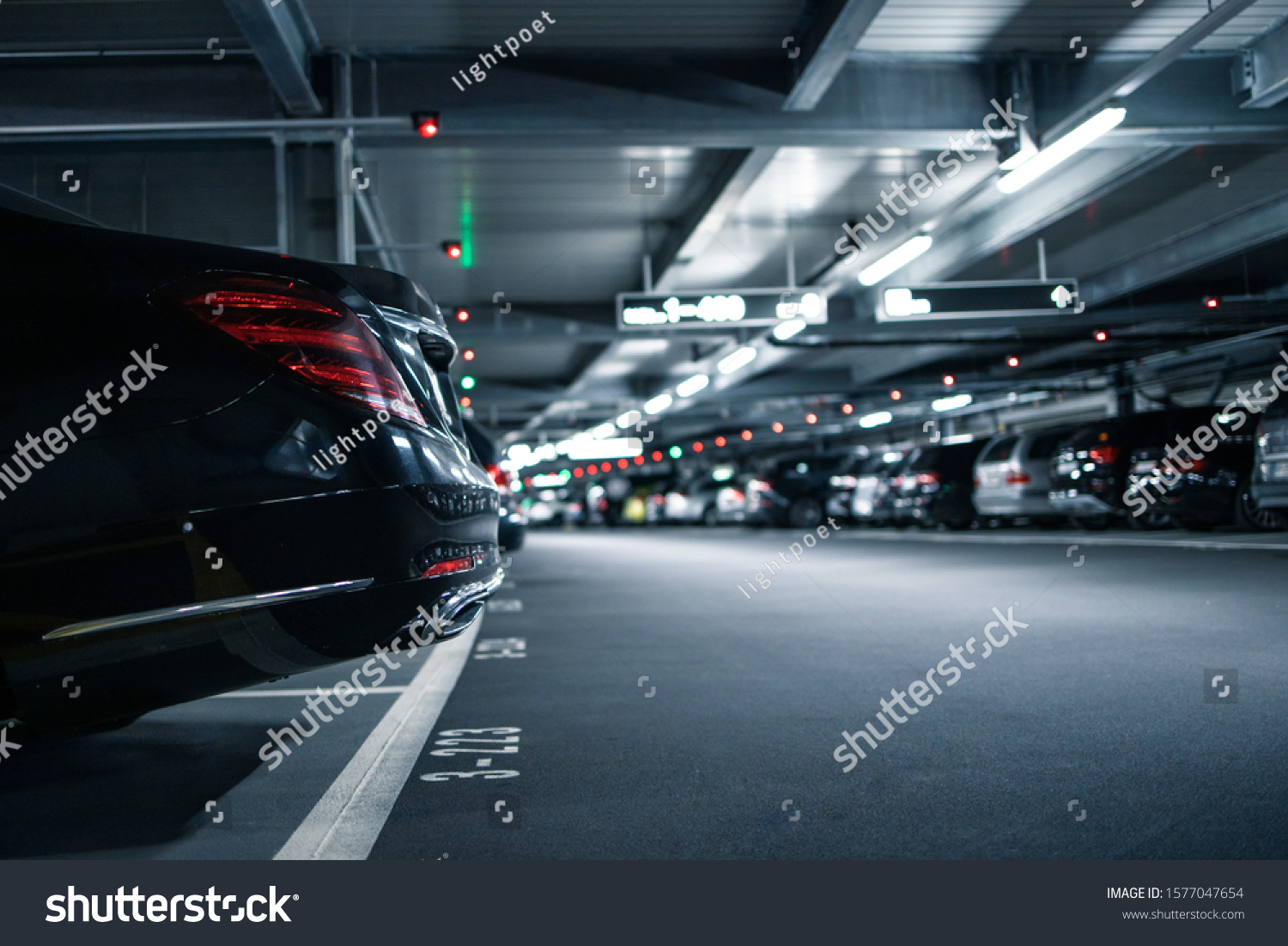 Underground garage or modern car parking with lots of vehicles #1577047654