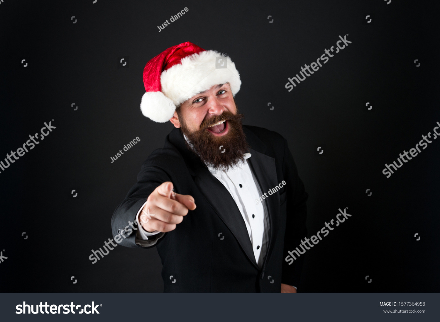 Naughty or nice. Happy Santa point finger at you. Christmas advertising. Focus on holiday advertising. Advertising product or event. Advertisement. Promotion and marketing. Festive advertising. #1577364958