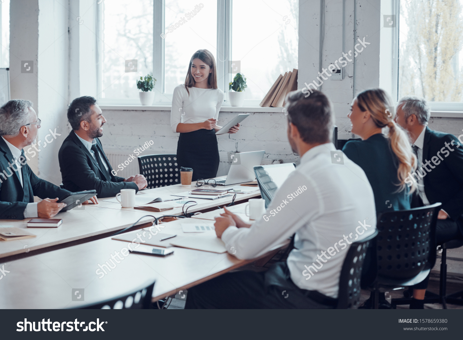 Professional business expert conducting meeting while working together with colleagues in the modern office #1578659380