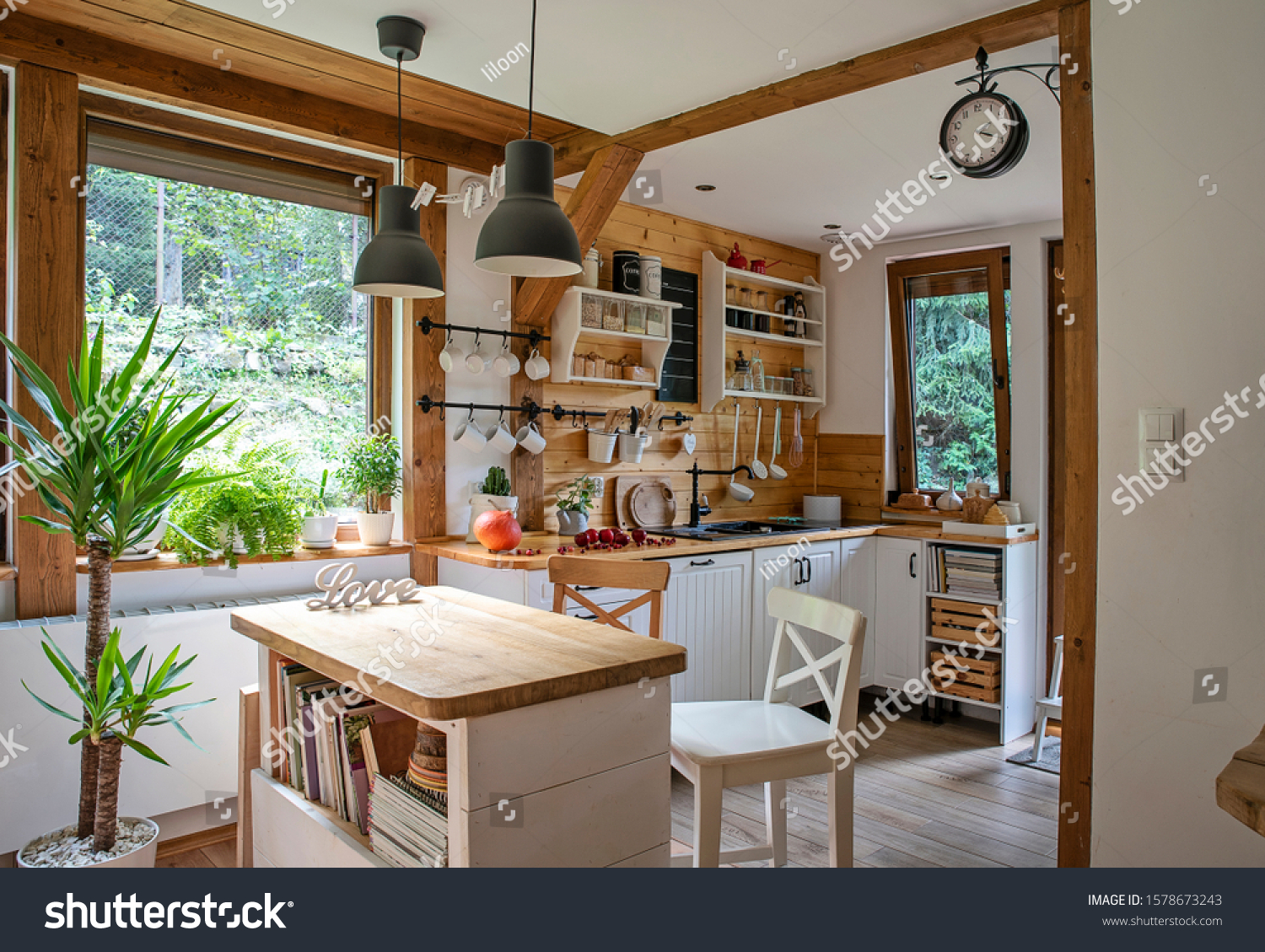 Vintage rustic interior of kitchen with white furniture, wooden wall and rustical decor. Bright indoor with window. Cottage style. #1578673243