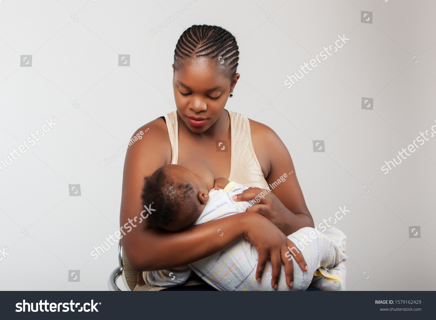 African black woman breast feeding her child. #1579162429