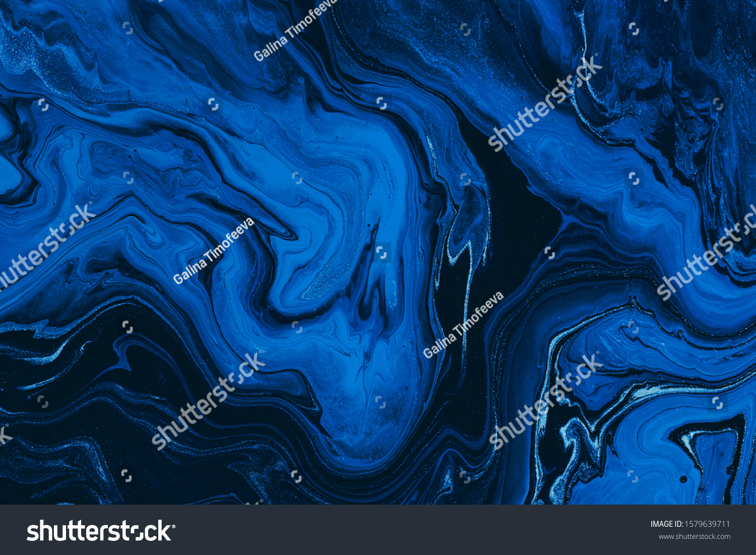 Classic blue color of the year 2020. Abstract fluid acrylic painting. Modern art. Marbled blue abstract background. Liquid marble pattern #1579639711