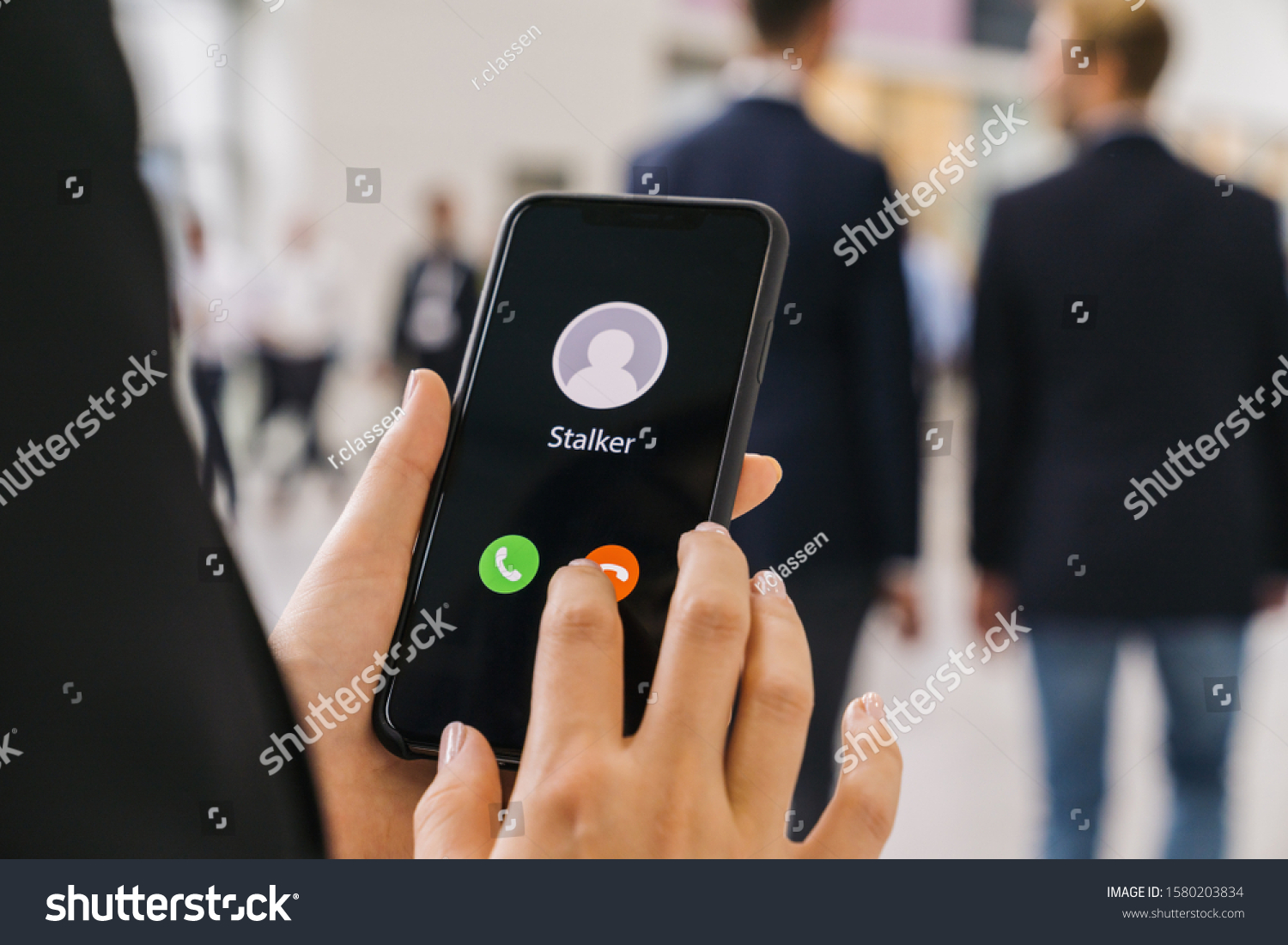 Businesswoman gets a Phone call from a stalker. Stalking or bullying with smartphone concept. Stalker caller, scammer or stranger. Woman answering to incoming call. Ex boyfriend with fake identity. #1580203834