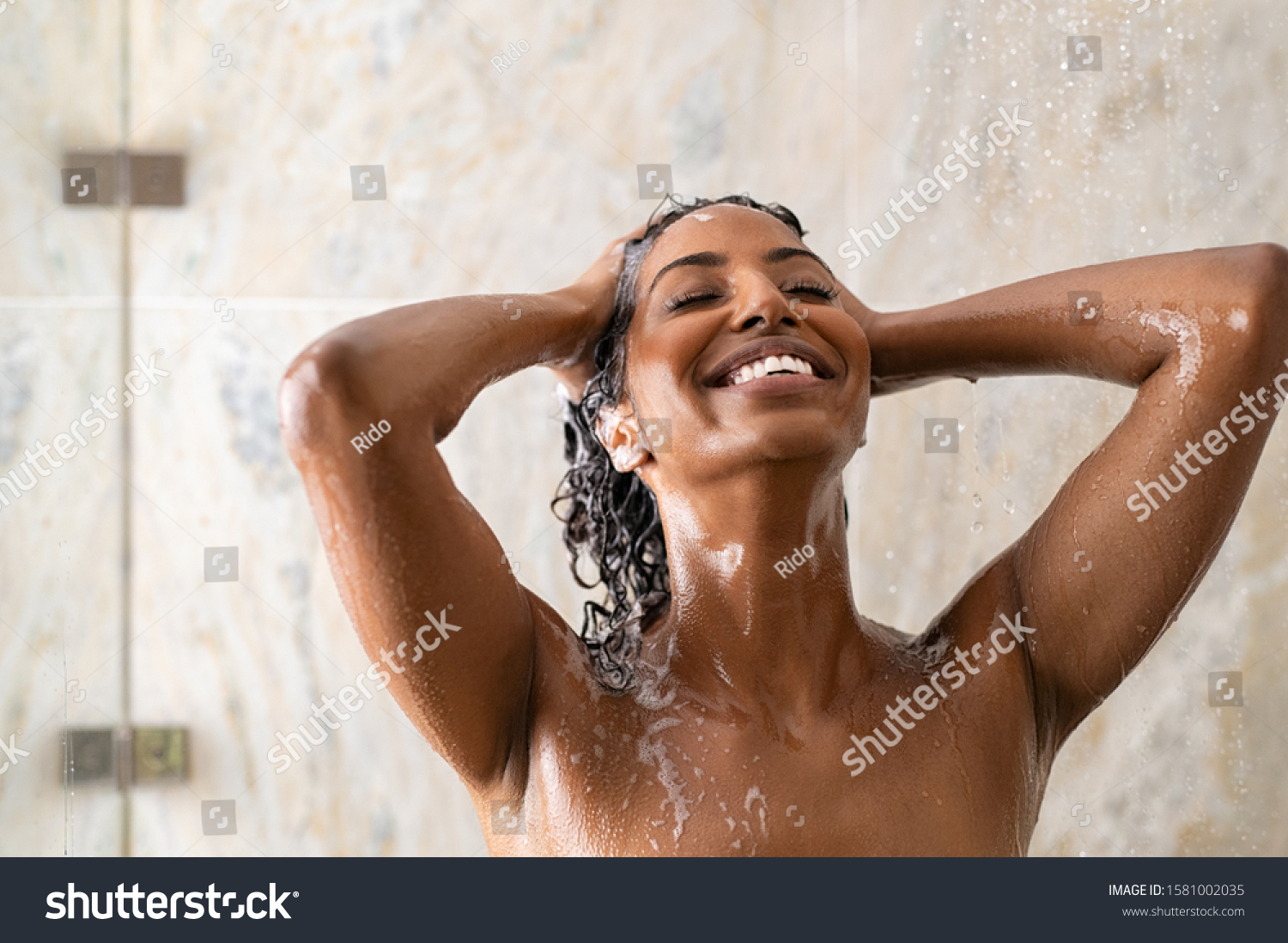 Young Woman Washing Hair In Shower At Luxury Spa Royalty Free Stock