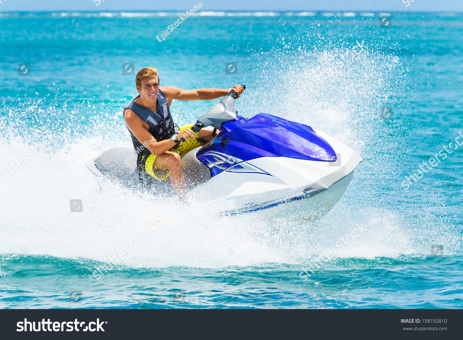 Young Man on Jet Ski, Tropical Ocean, Vacation Concept #158192810