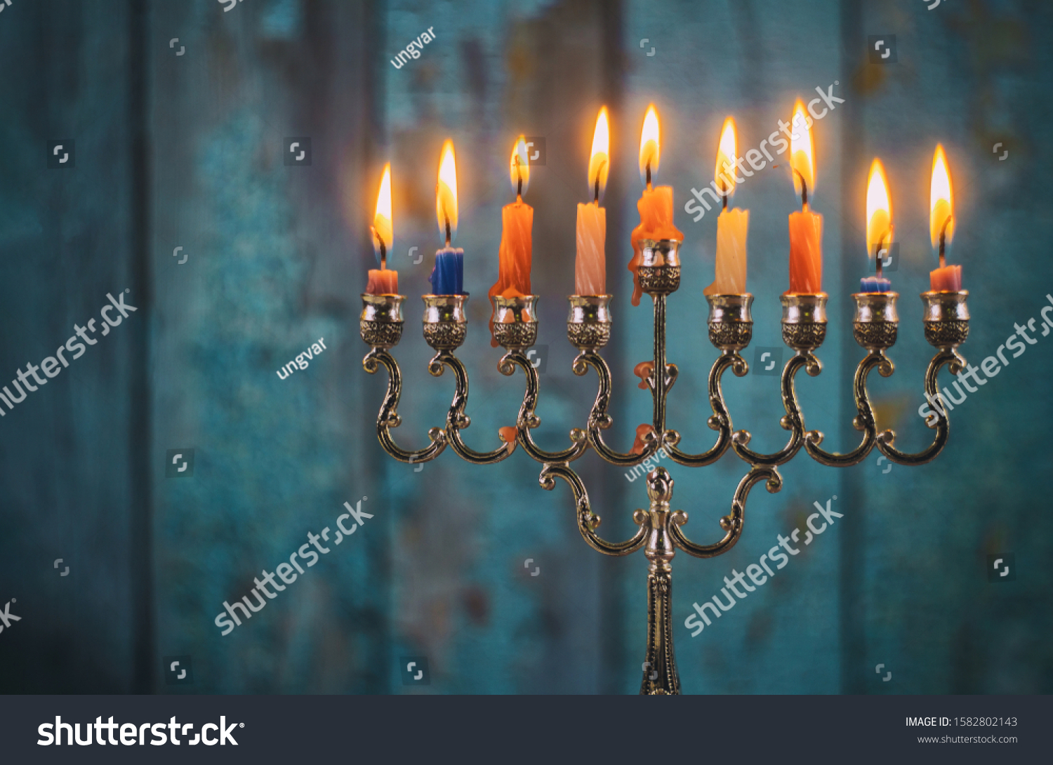 Jewish holiday, Holiday symbol Hanukkah Brightly Glowing Hanukkah Menorah soft focus #1582802143
