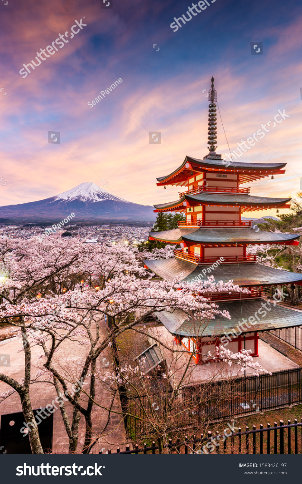 Fujiyoshida, Japan at Chureito Pagoda and Mt. Fuji in the spring with cherry blossoms. #1583426197