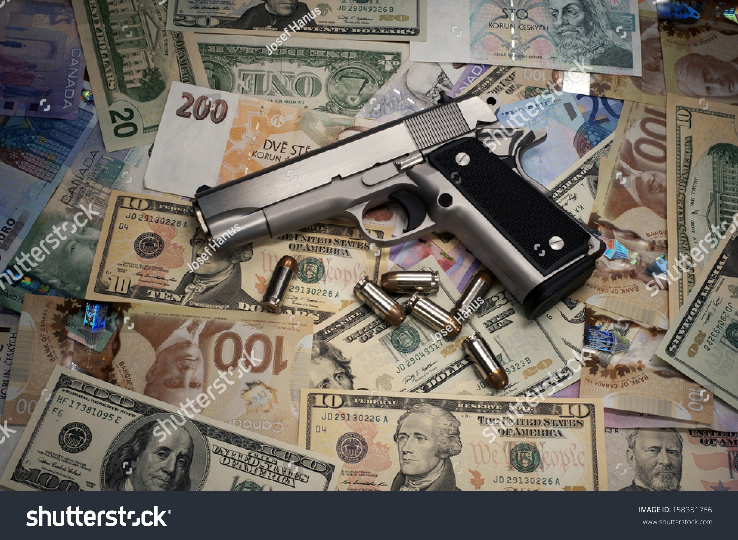 Royalty Free Gun And Money 158351756 Stock Photo Avopixcom