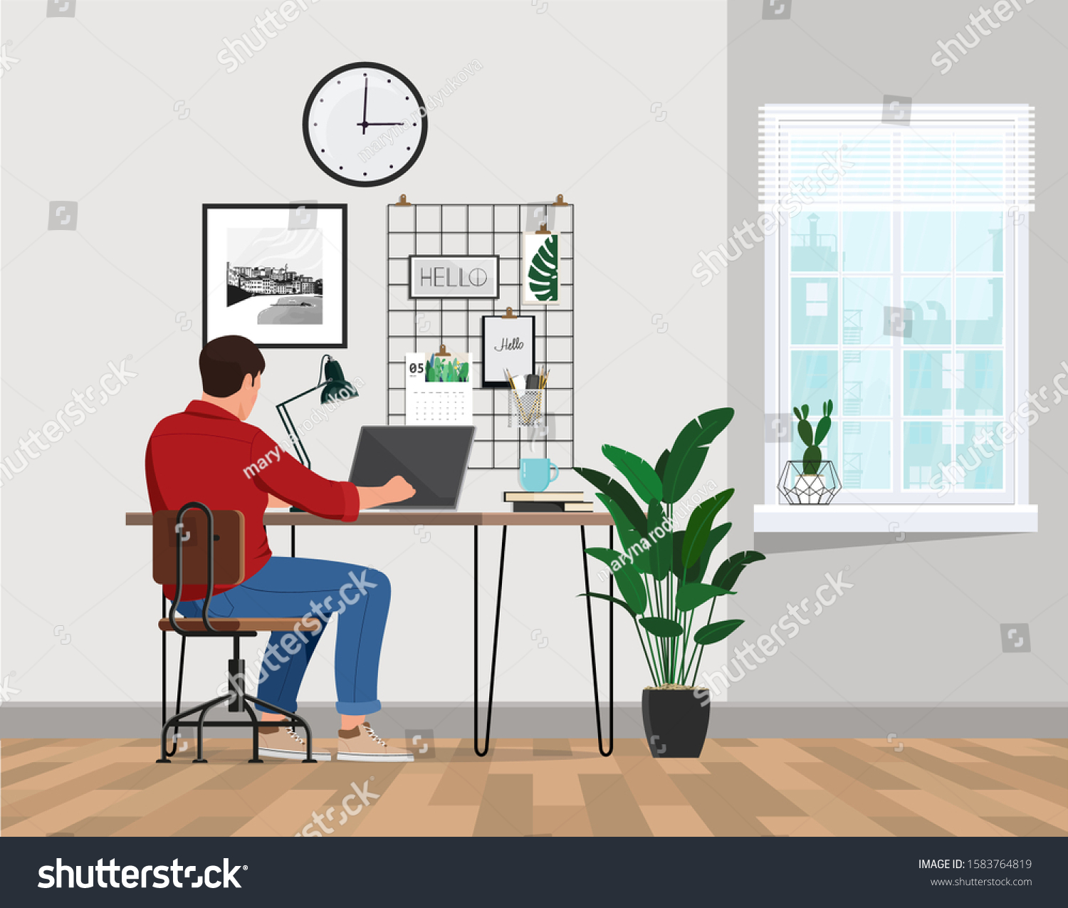 A freelancer man works behind a laptop. Home office workplace. #1583764819