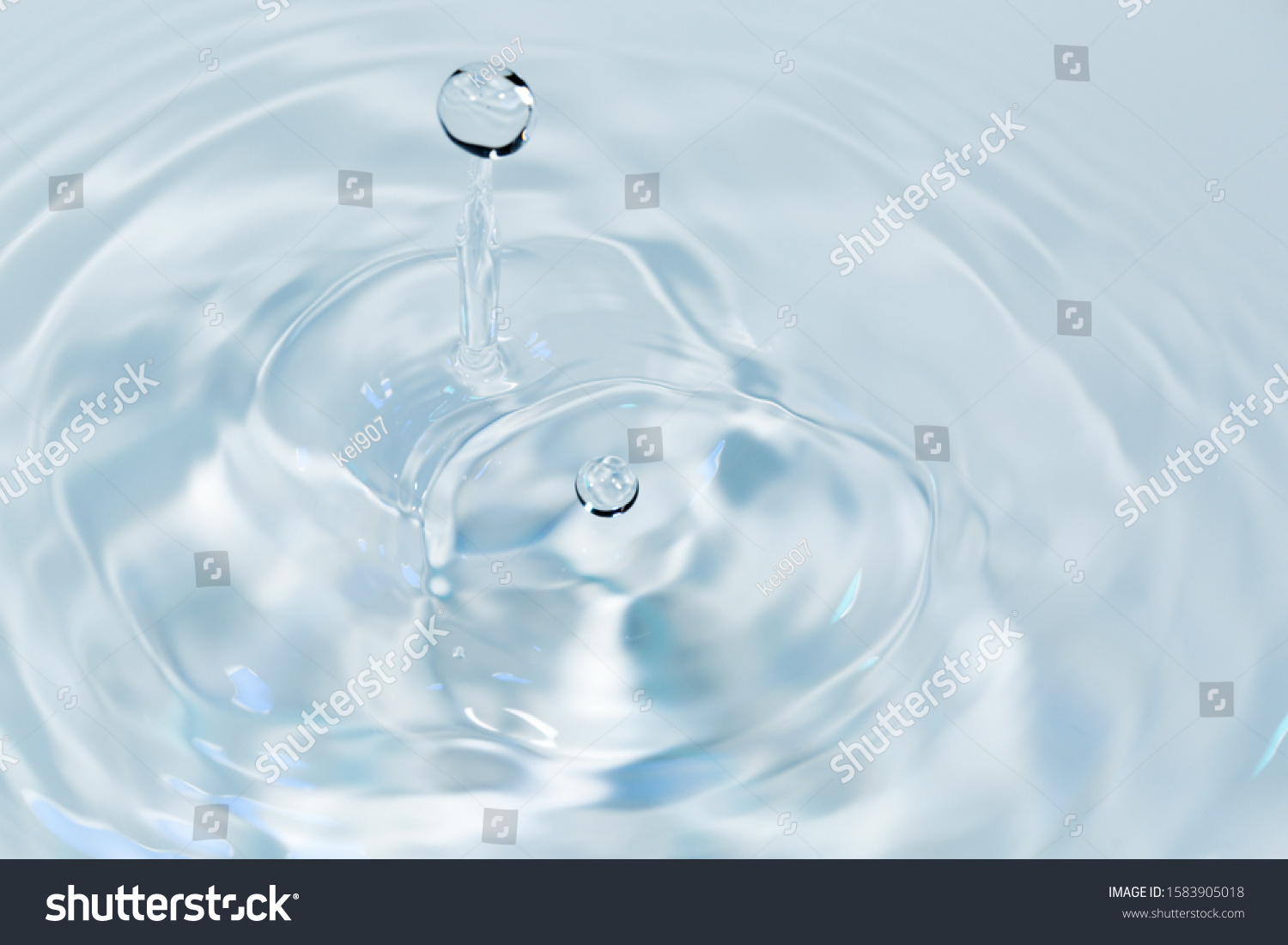 Water drops falling on water surface #1583905018