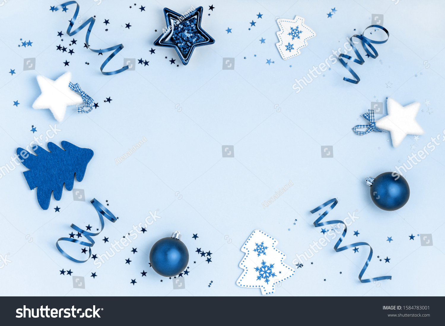 New Year and Christmas composition. Frame from balls, stars, chrismas tree on blue background. Top view, flat lay, copy space. Trendy color of the year 2020. #1584783001