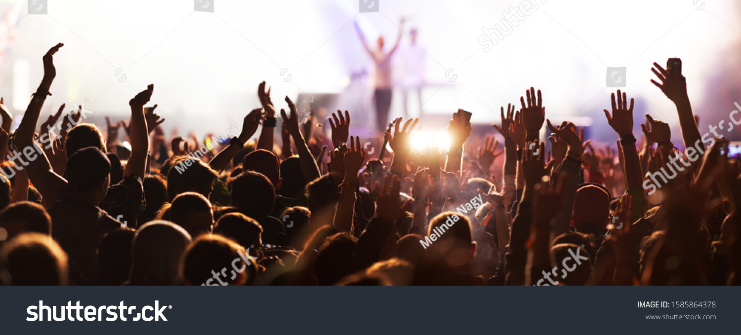 crowd with raised hands at concert festival banner #1585864378