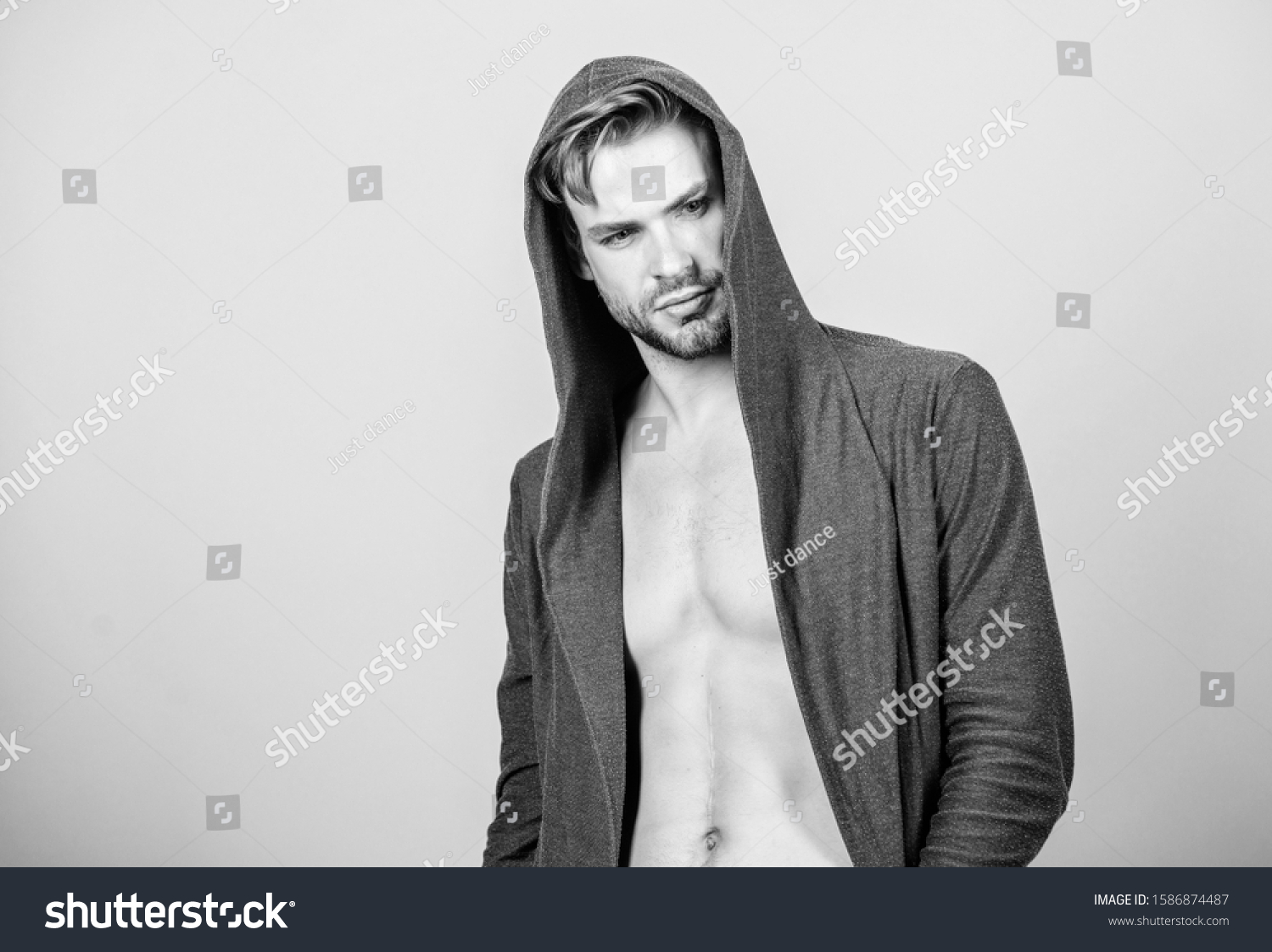 Masculinity concept. Masculinity and confidence. Man muscular torso wear hooded clothes. Unconventional but masculine look. Brute masculinity extremely commanding looking conventionally handsome. #1586874487