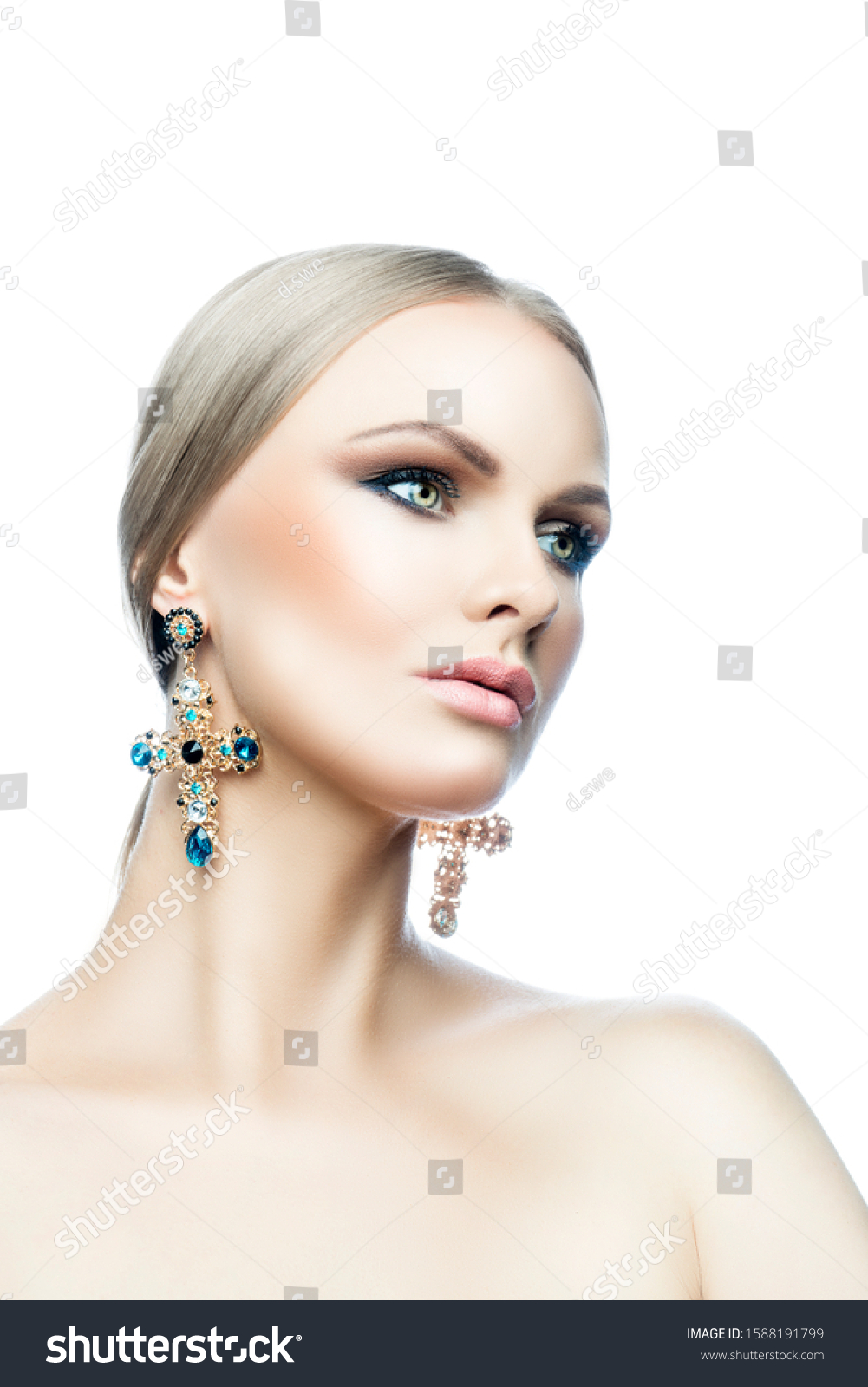 Beautiful fashion model woman studio beauty portrait, perfect skin, bright eye make-up, blonde hair style, big earrings with color stones, naked shoulder body. Isolated. White background. Copy space #1588191799