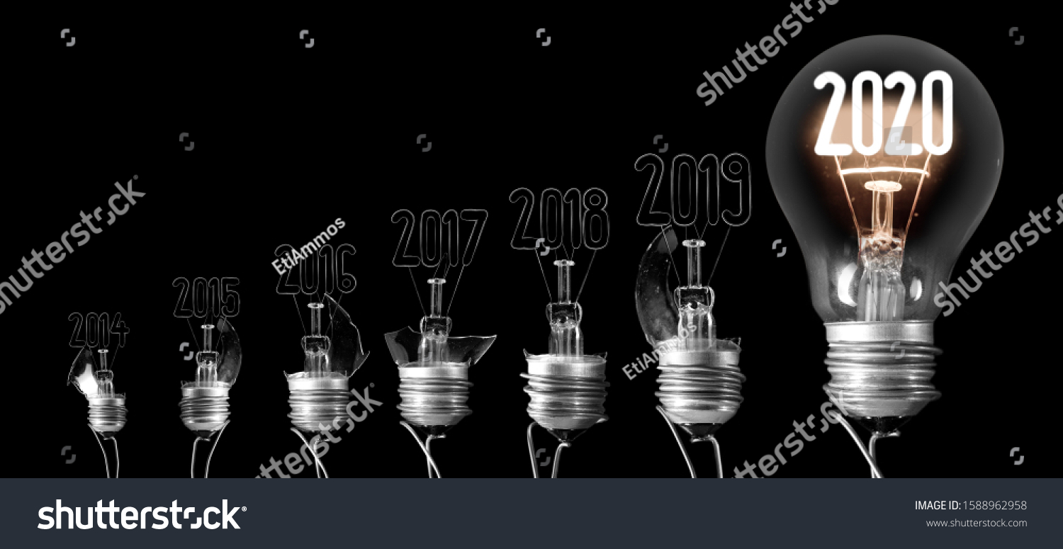 Group of shining and broken light bulbs in a shape of New Year 2020 and 2019 isolated on black background. #1588962958